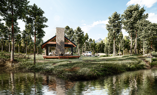 The exterior front facade of an A-frame cabin nestled in the woods beside a river, featuring parking space for your truck and trailer for weekend getaways. The cabin also showcases a deck area with outdoor furniture
