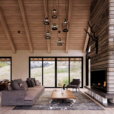 living design rendering with vaulted ceiling, pendant lamp, stone wall with chimney in a barndominium