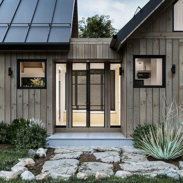 A detailed view of a breezeway in Moose Meadow’s cabin house design, featuring a vaulted ceiling that converges at the center. The space is enhanced by black-toned windows and doors, offering a sleek contrast to the rustic elements and providing a seamless connection to the backyard.