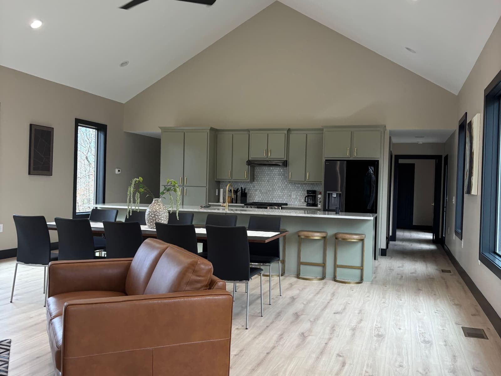The great room furnished, the kitchen beyond, under the vault.