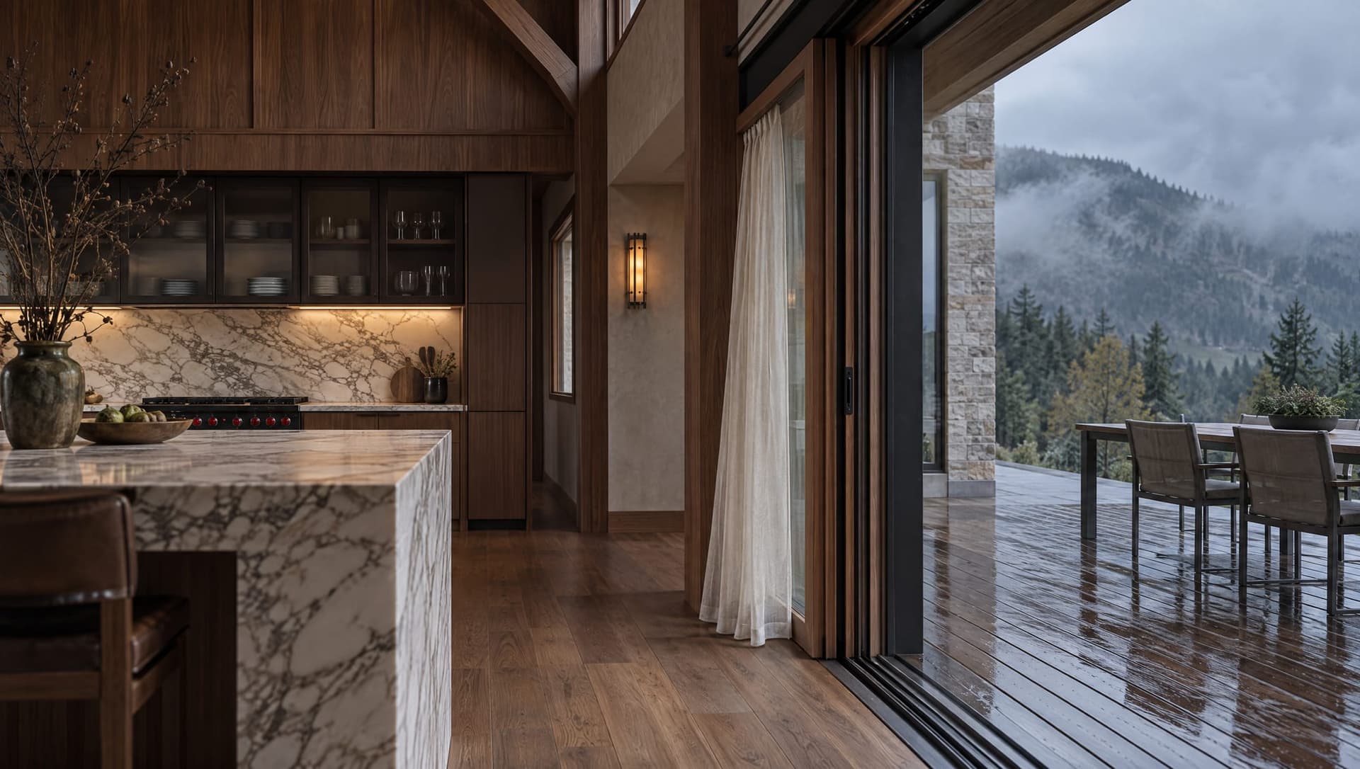 Kitchen of The Hunter’s Lodge, opening onto a wet deck and the mountain.