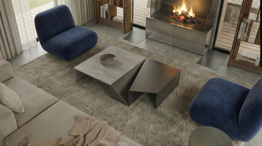 Bear's Lair, a modern living room with a fireplace, blue chairs, and a gray coffee table.  A residence with an open-concept layout, vaulted ceilings and expansive floor-to-ceiling windows. 