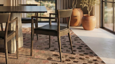 Coyote’s Den dining area with wooden chairs and a table on a patterned rug, with large windows in the background. 

CLARITY BEFORE THE NEXT STEP
We’ve gathered the most common questions about our designs, services, and next steps.