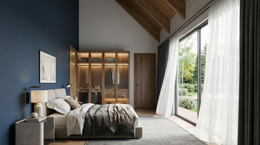 Snowy Owl's Lair, a modern bedroom with a large window, bed, and wooden wardrobe. With an open concept social area, and a single-story layout. 