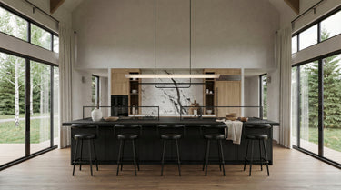 Snowy Owl's Lair, a modern kitchen with large windows and a black island with stools. With an open concept social area, and a single-story layout. 