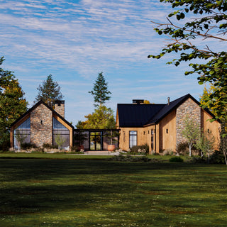Modern cabin house with stone and wood exterior in a green landscape