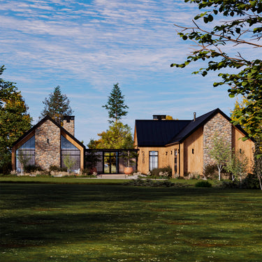 Modern cabin house with stone and wood exterior in a green landscape