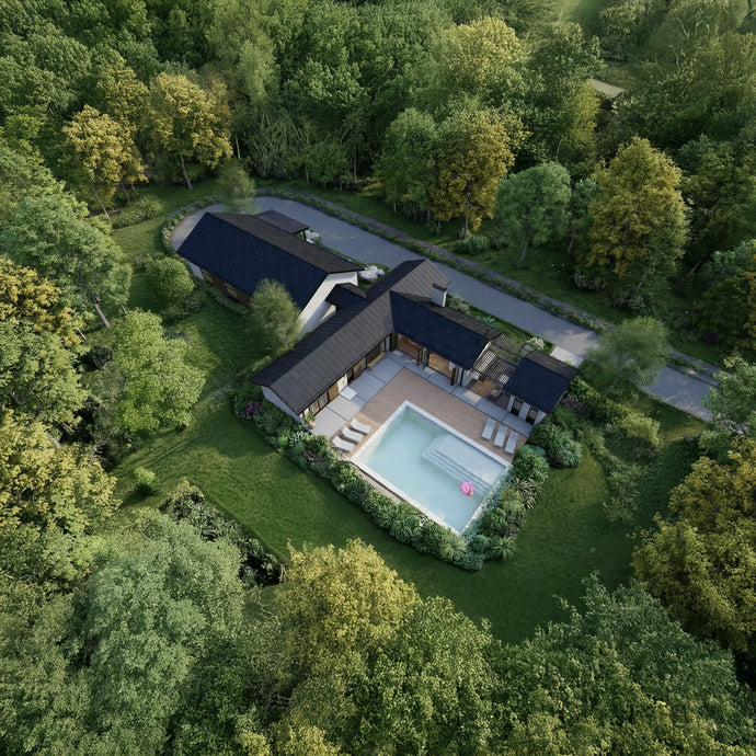 Aerial view of The Serene Villa is a modern pool house and weekend luxury retreat featuring a pool surrounded by trees, a detached garage conected by a dog trot breezeway, and an open-concept social area connected to the pool with accordion custom doors. 