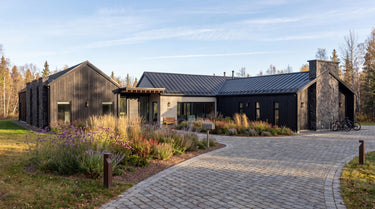 Modern house with a pool surrounded by trees and greenery in New York.