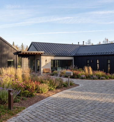 Modern house with a pool surrounded by trees and greenery in New York.