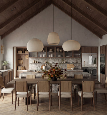 Modern kitchen with wooden dining table and chairs, large windows, and a vaulted ceiling. MODERN MOUNTAIN HOME, THE HUT COMPANY