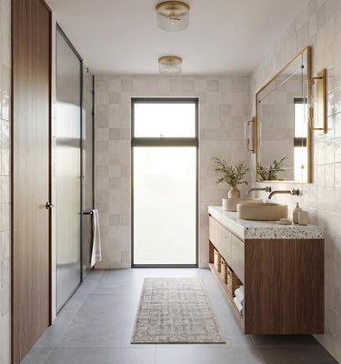 Modern bathroom with wooden vanity, large mirror, and glass shower door. Modern Mountain Home. THE HUT COMPANY