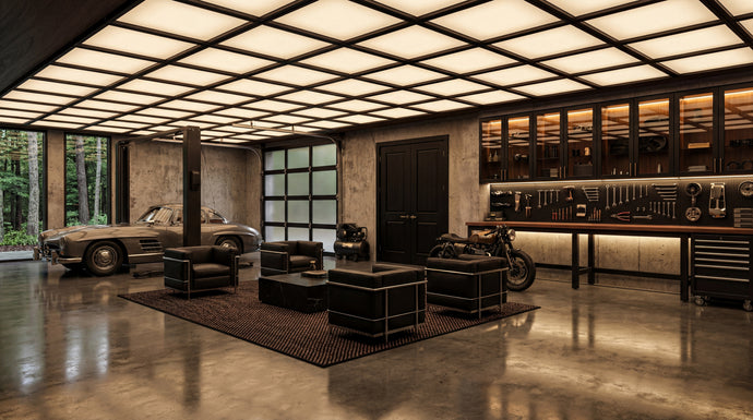 Modern garage with cars, furniture, and tools under a grid ceiling.