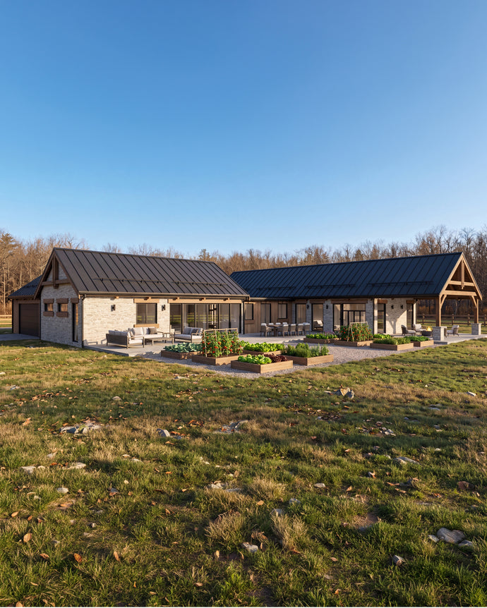 The Maine Project: A modern single-story house with a dark metal roof, light stone exterior, and large glass walls, shown on a grassy lot under a clear blue sky.